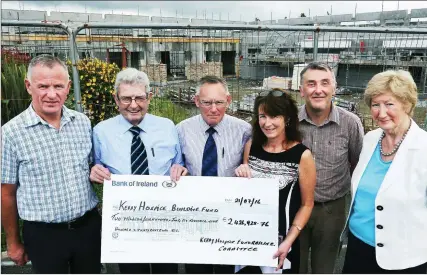  ?? Photo by John Cleary ?? Kerry Hospice Foundation Chairman Ted Moynihan (second from left) presenting the big cheque - for €2,426,938.76 - to the Hospice Building Committee under consultant surgeon Tom McCormack (centre), with, from left: Dan Galvin (KHF), Dr Patricia Sheahan...