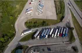  ?? Benjamin B. Braun/Post-Gazette ?? Trucks parked at the New Stanton Service Plaza last month in Hempfield Township, Westmorela­nd County.