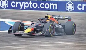  ?? JOHN DAVID MERCER/USA TODAY SPORTS ?? Red Bull driver Max Verstappen steers into Turn 1 during the Formula One Miami Grand Prix on Sunday.