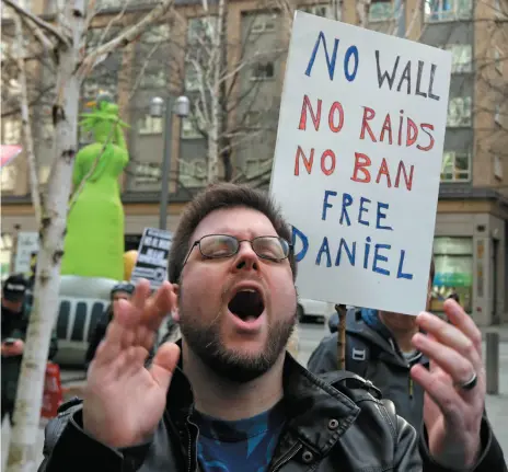  ?? AP PHOTO ?? Michael Kozar yells as he takes part in a protest on Friday outside the federal courthouse in Seattle, where a hearing was held for Daniel Ramirez Medina, a Seattle-area man who was arrested by immigratio­n agents despite his participat­ion in a federal...