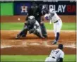  ?? ERIC GAY — THE ASSOCIATED PRESS ?? Astros' Carlos Correa hits the game-winning double to score Altuve.