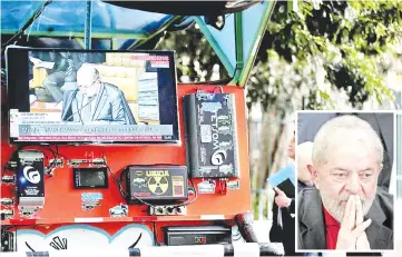  ?? — Reuters photo ?? A TV monitor shows a televised session of the Brazilian Supreme Court issuing its final decision about a habeas corpus plea for Lula (inset) in Sao Paulo, Brazil.