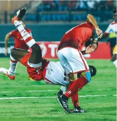  ??  ?? Stroung...Al Ahly’s Walid Soliman (right) gets ther better of Horoya’s Ocansey Mandela