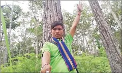  ?? FACEBOOK ?? A person takes a photo with a tree earlier this year as part of a deforestat­ion awareness campaign.