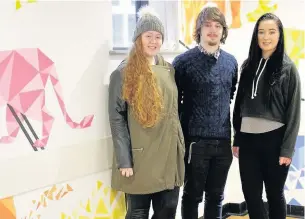  ??  ?? ●●Students Natasha Holmes, George Cunningham and Elizabeth Simmons with the new murals