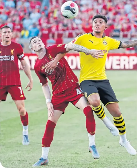  ??  ?? Ryan Kent came up against Borussia Dortmund’s Jadon Sancho during Liverpool’s friendly in Indiana yesterday