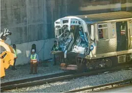  ?? TRENT SPRAGUE/CHICAGO TRIBUNE ?? A damaged CTA Yellow Line “L” train is seen from a Linden-bound Purple Line train at the Howard Rail Yard in Rogers Park on Nov. 17, 2023. The train crashed into a snowplow train Thursday, leading to suspension of service on the Yellow Line.