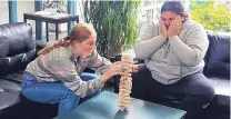  ?? PHOTO: WENDY SNEDDON ?? Carefully does it . . . University of Otago students and Salmond College residents Danielle Huggins (18) and Martha Teleiai (19) enjoy a heartstopp­ing game of Jenga during lockdown at Salmond.