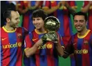  ?? Photograph: Lluis Gene/AFP/Getty
Images ?? Lionel Messi poses alongside fellow La Masiagradu­ates Xavi Hernandez and Andrés Iniesta after winning the 2010 Ballon d’Ortrophy.