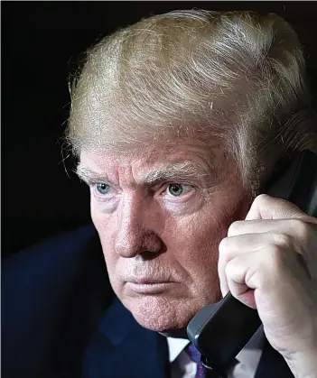  ??  ?? President Trump talks with troops via phone from his Mar-a-Lago estate on Thanksgivi­ng Day on Thursday