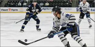  ?? Special to Okanagan Newspaper Group ?? Fargo Force forward Casey McDonald controls a puck in this undated handout photo. The 20year-old McDonald has committed to the Penticton Vees of the BCHL for the 2021 season.