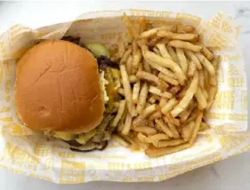  ?? Hal B. Klein/Post-Gazette ?? The Oakland burger at the new Burghers Brewing at The Highline.