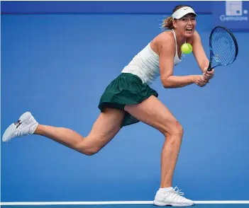  ?? AFP ?? Russia’s Maria Sharapova in action against Mihaela Buzarnescu of Romania at the Shenzhen Open tennis tournament on Monday. Sharapova won 6- 3, 6- 0. —