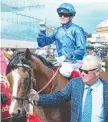  ??  ?? Jockey Craig Williams brings Hartnell back to scale