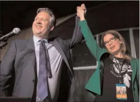 ?? The Canadian Press ?? Vancouver mayor-elect Kennedy Stewart, left, celebrates with his wife Dr. Jeanette Ashe after addressing supporters in Vancouver