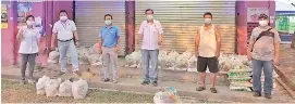  ??  ?? Likas Community Developmen­t Leader Tan Kim Poh (third left) and the Likas UPPM team helping to sort out the food aid.