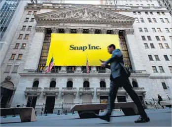 ?? Drew Angerer Getty images ?? THE DROP in Snap shares late Wednesday, to just above their IPO price of $17, suggests that many investors aren’t yet buying into the Snapchat strategy. Above, the New York Stock Exchange in March.