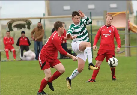  ??  ?? Action from Strand Celtic v Aughanagh. Pic: Carl Brennan.