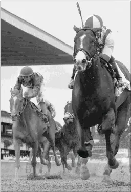  ?? BARBARA D. LIVINGSTON ?? Code of Honor (left) runs second to Complexity Oct. 6 in the Champagne. He returns Saturday in the Mucho Macho Man.