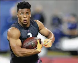  ?? DARRON CUMMINGS / AP ?? Penn State’s Saquon Barkley put on a show at the combine. The former Nittany Lions star should be the first running back selected in April’s NFL draft.