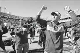  ?? [BRYAN TERRY/ THE OKLAHOMAN] ?? Lincoln Riley, celebratin­g after the Red River Showdown in October, had to be excited again Friday. His OU football team landed a pair of big-time verbal commitment­s in the 2021 recruiting class.