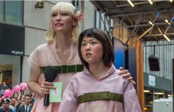  ?? BARRY WETCHER/THE WASHINGTON POST/NETFLIX ?? Tilda Swinton and Seo-Hyun Ahn star in Okja, a Netflix film that is up for the Palme d’Or award at Cannes. The film will not have a traditiona­l theatrical release, a cause of uproar at the festival.