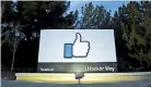  ??  ?? A lit sign is seen at the entrance to Facebook's corporate headquarte­rs location in Menlo Park, California