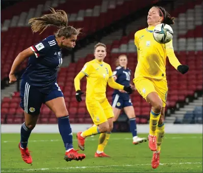  ?? ?? Abigail Harrison fires her header into the Ukraine goal to equalise at the death for Scotland