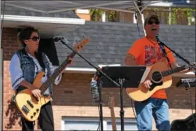  ?? MARIAN DENNIS — DIGITAL FIRST MEDIA ?? Live music could be heard and seen at both ends of Main Street as guests made their way through blocks of tables during Royersford Community Day.