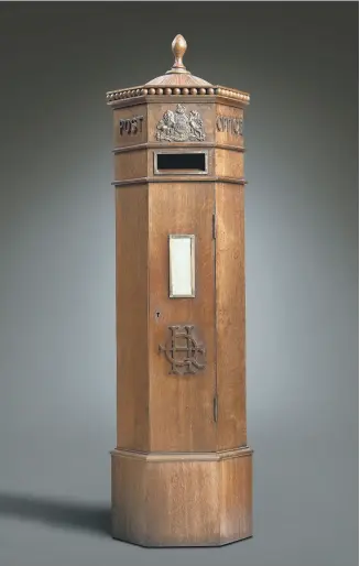  ?? ?? FROM HOTEL LOBBY: This Victorian oak postbox made £5,625 at Woolley & Wallis.