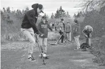  ??  ?? Youth try out their scooters and skateboard­s on the property recently acquired by the Barrington Leisure Park Associatio­n to develop an outdoor leisure park that will feature skatepark and splash pad amenities.