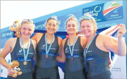  ?? Photo / Supplied ?? New Zealand junior women’s four in celebrator­y mood after receiving their bronze medals in Racice, Czech Republic. From left, Holly Mills (Waikato Diocesan School for Girls), Grace Watson (St Paul’s Collegiate), Brooke Kilmister (St Peter’s School), Kayla Baker (Nelson Rowing Club).