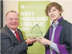  ??  ?? Geoff Wright, left, is presented with his Most Inspiring Lecturer Award award by Callum Stephen, Vice President Further Education at the Highlands and Islands Students’ Associatio­n.