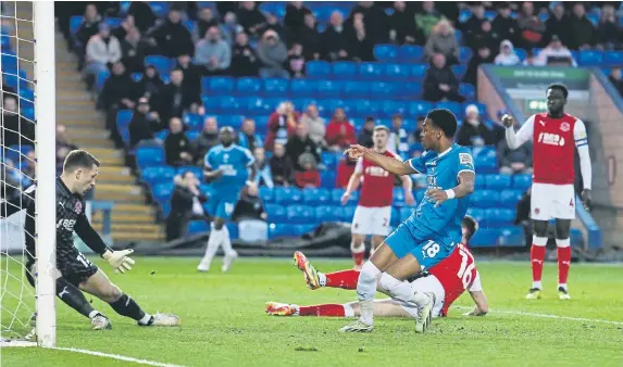  ?? ?? Malik Mothersill­e scores the first Football League goal of his career for Posh against Fleetwood. Photos Joe Dent/thePosh.com and David Lowndes.