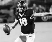  ?? STEPHEN M. DOWELL/ORLANDO SENTINEL ?? UCF quarterbac­k McKenzie Milton scrambles during the the Knights’ win over SMU. Milton said he would be more careful about taking hits after an injury scare Saturday.