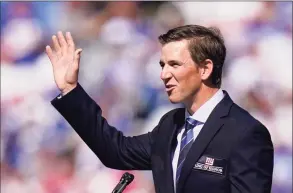  ?? Seth Wenig / Associated Press ?? Former New York Giants quarterbac­k Eli Manning addresses the crowd during a ceremony to retire his jersey number 10 and honor his tenure with the team during halftimeof Sunday’s game against the Atlanta Falcons in East Rutherford, N.J.