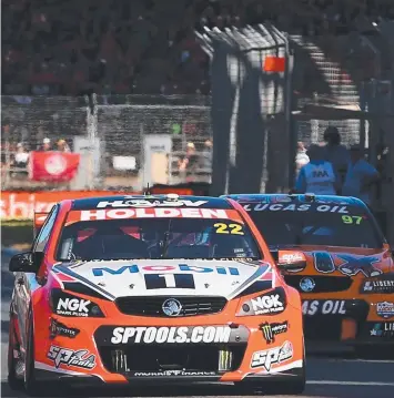  ??  ?? OUT IN FRONT: James Courtney leads race three of the Clipsal 500 in his Holden Racing Team car.