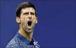  ?? ADAM HUNGER — ASSOCIATED PRESS ?? Novak Djokovic celebrates a point against Richard Gasquet during their third-round match at the U.S. Open in New York on Monday.