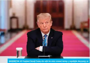  ??  ?? WASHINGTON: US President Donald Trump sits with his arms crossed during a roundtable discussion on the Safe Reopening of America’s Schools during the coronaviru­s pandemic, in the East Room of the White House. — AFP