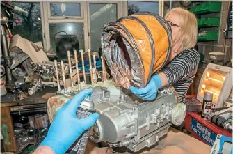  ??  ?? Spraying the engine unit with SWMBO holding the pipe from the extractor fan to take the overspray and paint fumes outside where they belong.