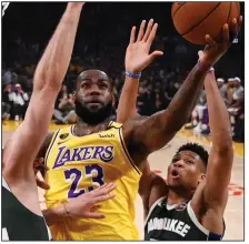  ?? (AP/Mark J. Terrill) ?? Los Angeles Lakers forward LeBron James said if the NBA plays games without fans because of the coronaviru­s, he said he will not participat­e. James made the comment after the NBA warned teams about the potential of playing games in empty arenas.