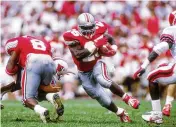  ?? RICK STEWART / ALLSPORT 1991 ?? Carlos Snow led Ohio State in rushing in the 1988, ’89 and ’91 seasons, missing out in 1990 when he had a benign tumor removed from his thigh.