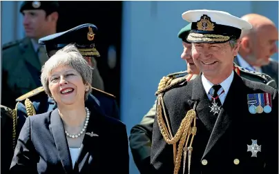  ??  ?? Prime Minister Theresa May with Vice Admiral Sir Timothy Laurence during celebratio­ns marking National Armed Forces Day in Llandudno, Wales, at the weekend.AP