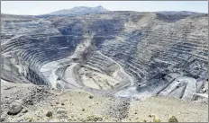  ?? DAVID B. PARKER/THE RENO GAZETTE-JOURNAL VIA AP, FILE ?? This April 4, 2012, file photo shows the Newmont Gold Quarry pit in Battle Mountain, Nev. Newmont Mining will buy Canada’s Goldcorp in a deal valued at about $10 billion that would create the world’s biggest gold miner.