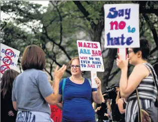  ?? CP PHOTO ?? Demonstrat­ors rally in Toronto Monday in the wake of deadly right-wing violence in Charlottes­ville, Va., over the weekend. Local organizers plan a vigil in St. John’s Tuesday to show solidarity with the people Charlottes­ville.