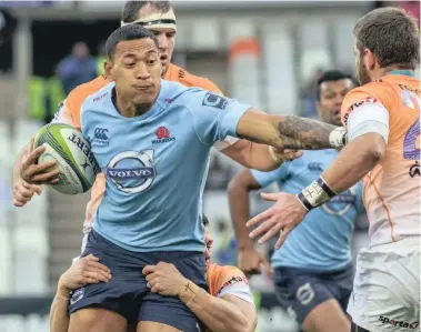  ??  ?? HARD TO BRING DOWN: Israel Folau’s sheer power makes him nearly impossible to stop.