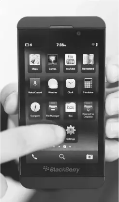  ?? KEVORK DJANSEZIAN/ GETTY IMAGES ?? The new BlackBerry Z10 smartphone, launched in the U.S. on Friday, has swapped its signature keyboard for a touch-screen.