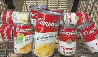  ?? AP FILE PHOTO ?? SOUP’S ON: A variety of Campbell’s soups are shown in a grocery cart. Campbell Soup Co. yesterday announced plans to sell its internatio­nal business.