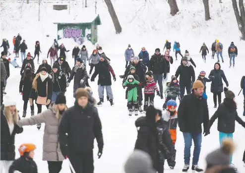  ?? GRAHAM HUGHES / THE CANADIAN PRESS ?? People skate on a lake in a city park in Montreal last month before tightened COVID restrictio­ns were brought into effect in Quebec.