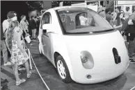  ?? PROVIDED TO CHINA DAILY ?? Google’s self-driving car, a vehicle capable of sensing its environmen­t and navigating without human input, is on display during a tech show in Paris.